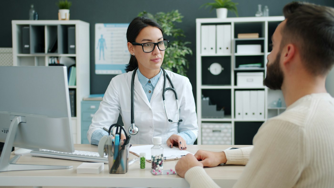 A doctor consulting with a patient in a clinic